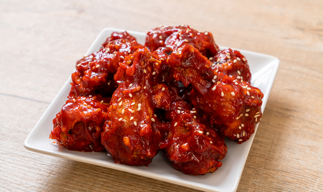 Close-up of chicken baked with hot sauce.